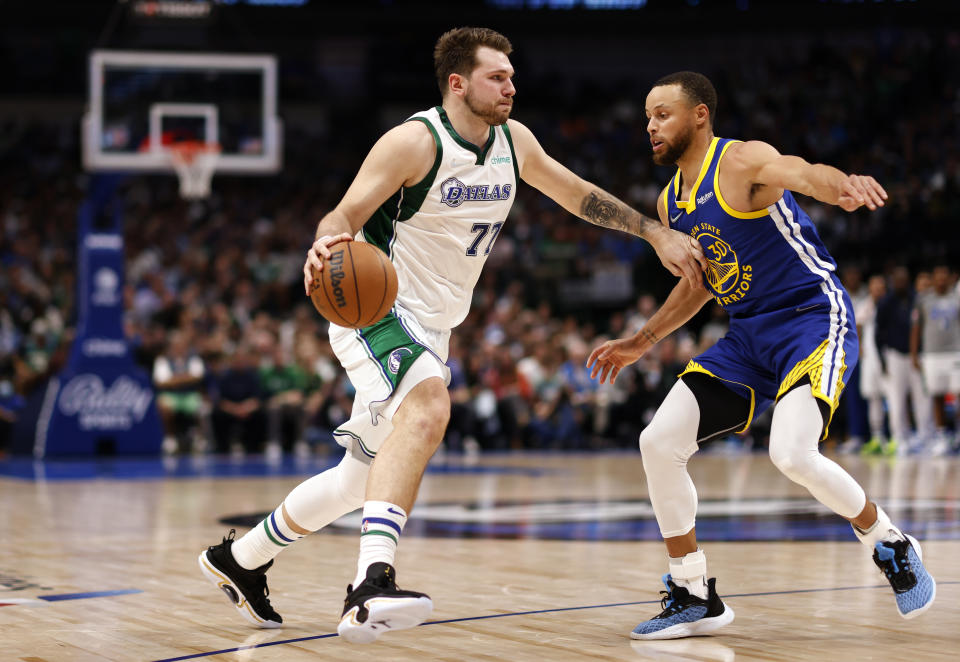 Luka Doncic and Stephen Curry are the top two choices for DFS lineups in Game 1 of the West finals. (Photo by Ron Jenkins/Getty Images)