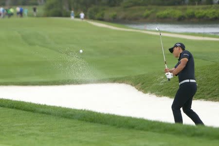 Apr 15, 2018; Hilton Head, SC, USA; Si Woo Kim hits from out of the bunker on the 5th hole during the final round of the RBC Heritage golf tournament at Harbour Town Golf Links. Mandatory Credit: Joshua S. Kelly-USA TODAY Sports