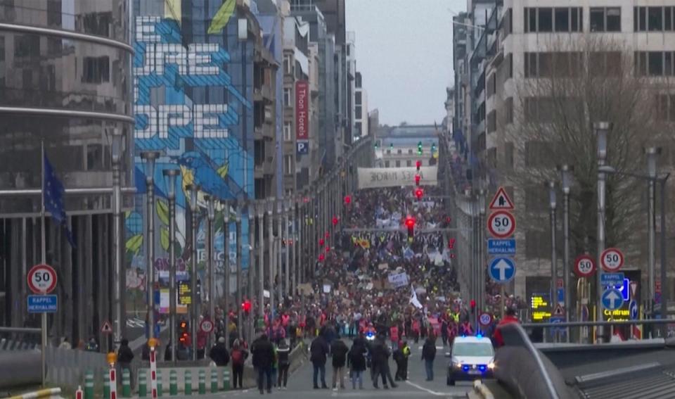 Thousands marched in Brussels as many campaigners chose to avoid the restrictions in Dubai and stage protests closer to home (AP)