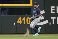 Seattle Mariners center fielder Julio Rodriguez pursues a run-scoring single hit by Texas Rangers' Marcus Semien in the seventh inning of a baseball game in Arlington, Texas, Thursday, April 25, 2024. The hit scored Wyatt Langford. (AP Photo/Tony Gutierrez)