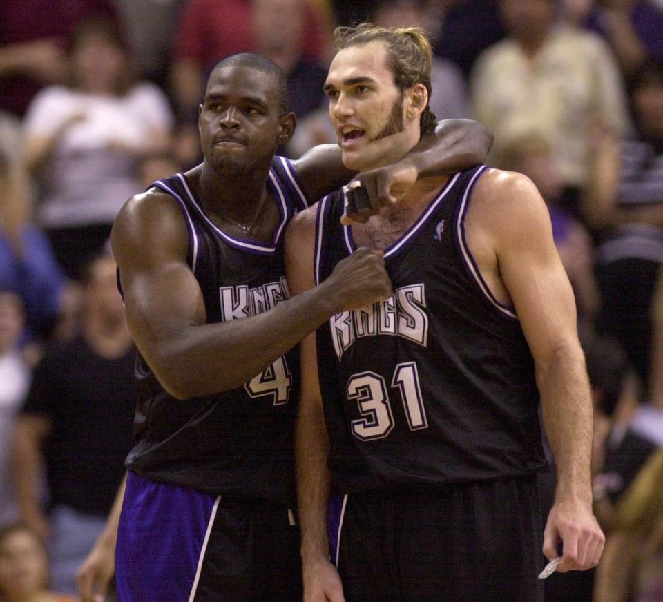 Chris Webber gives Sacramento Kings teammate Scot Pollard a thump on the chest as team secured a Game 4 first-round win over the Phoenix Suns on May 2, 2001. CHRIS CREWELL/Sacramento Bee file