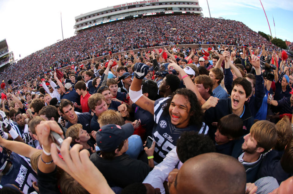 OXFORD, MS - OCTOBER 4: Fans of the Ole Miss Rebels rush the field to celebrate the victory over the Alabama Crimson Tide on OCTOBER 4, 2014 at Vaught-Hemingway Stadium in Oxford, Mississippi. Mississippi beat Alabama 23-17. (Photo by Joe Murphy/Getty Images)