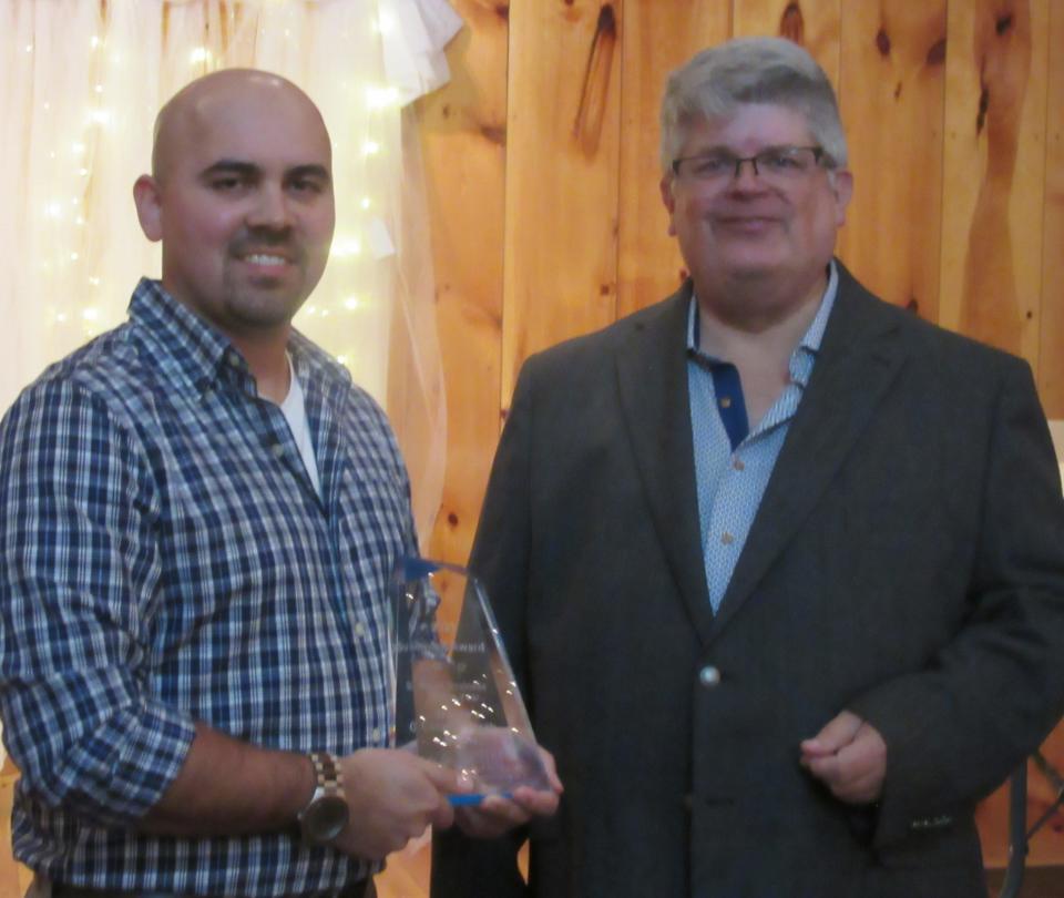 Chamber president Randy Crane (right) recognized Wayne’s Meats represented by Bruce Harrison as the Small Business of the Year.