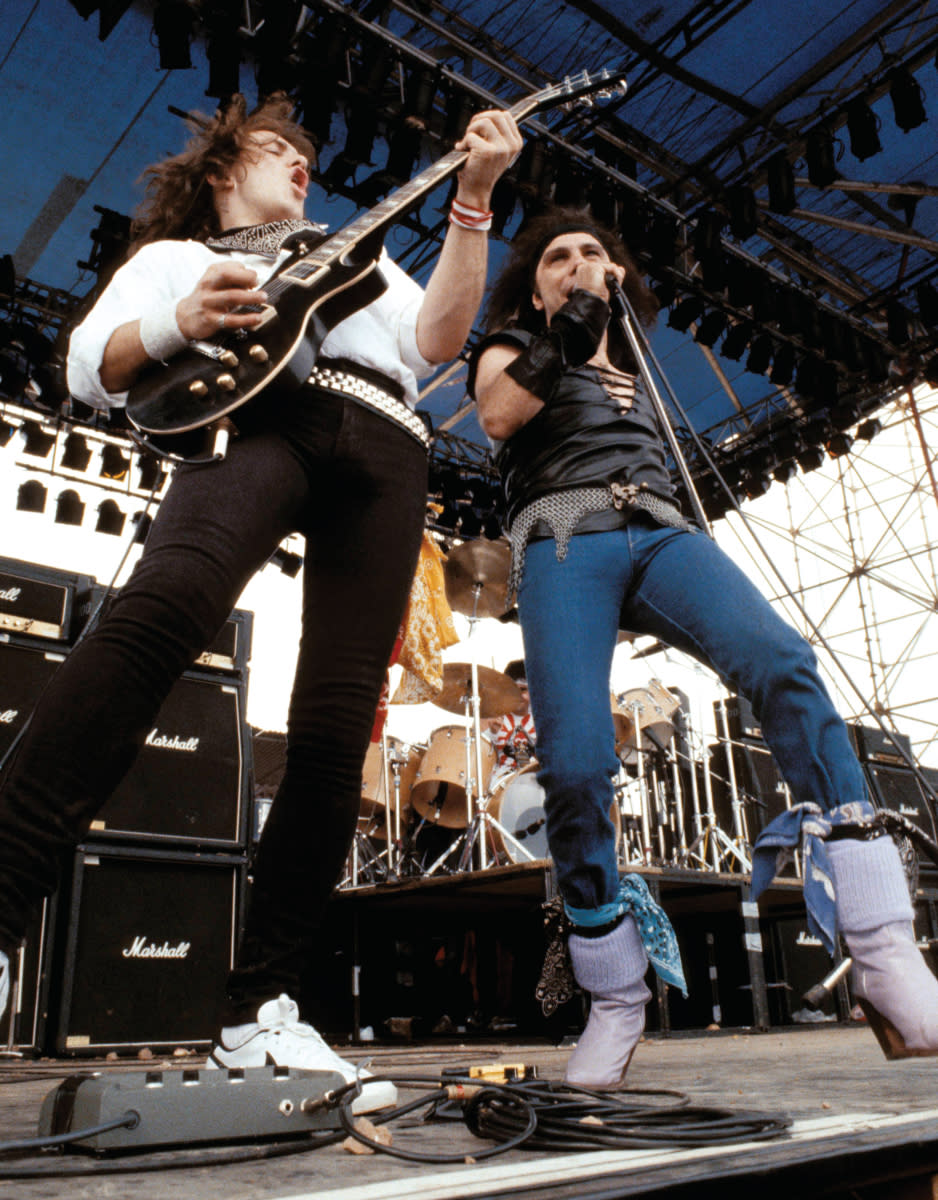 Campbell performs  onstage with Ronnie  James Dio in 1983.