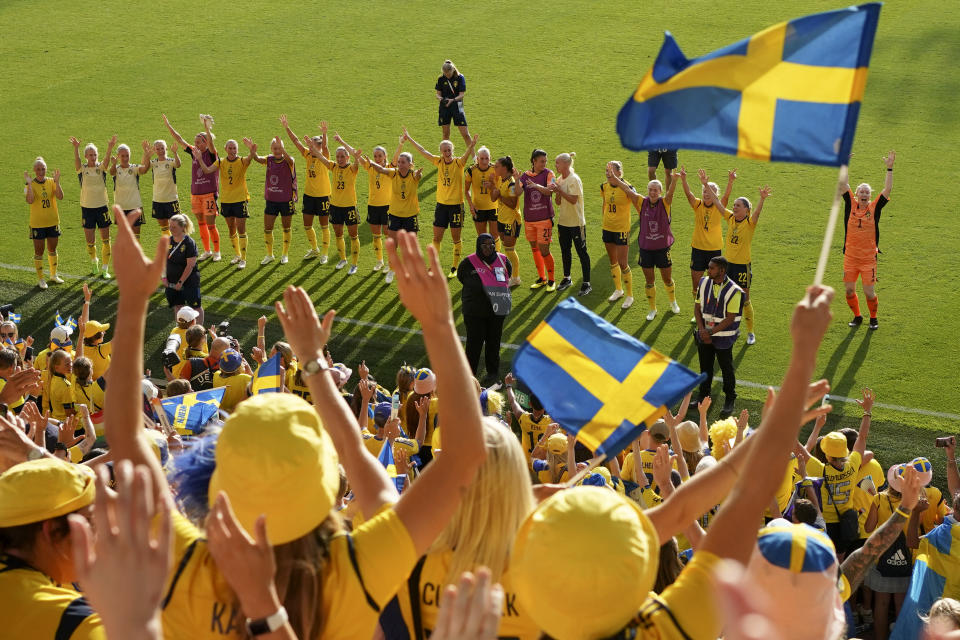 Sweden players celebrate with the fans at the end of the Women Euro 2022 group C soccer match between Sweden and Portugal at Leigh Sports Village, in Leigh, Manchester, England, Sunday, July 17, 2022. Sweden won 5-0 to advance to the quarterfinals. (AP Photo/Jon Super)