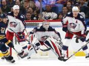 Nov 20, 2017; Buffalo, NY, USA; Columbus Blue Jackets goalie Sergei Bobrovsky (72) watches the puck as center Brandon Dubinsky (17) and defenseman Jack Johnson (7) defend during the third period at KeyBank Center. Kevin Hoffman-USA TODAY Sports