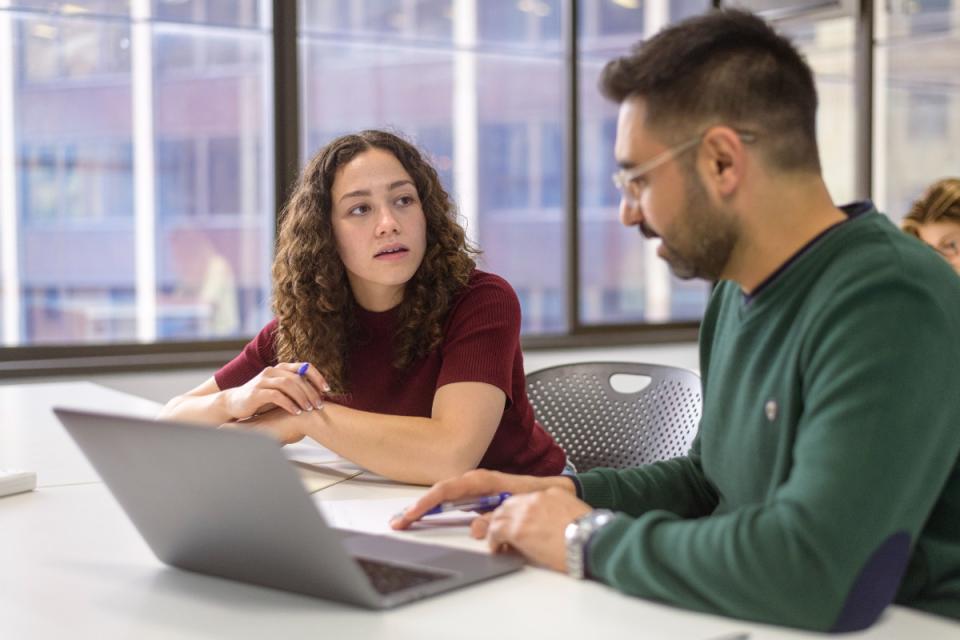 Female and male university students studying together ahead of the Budget.