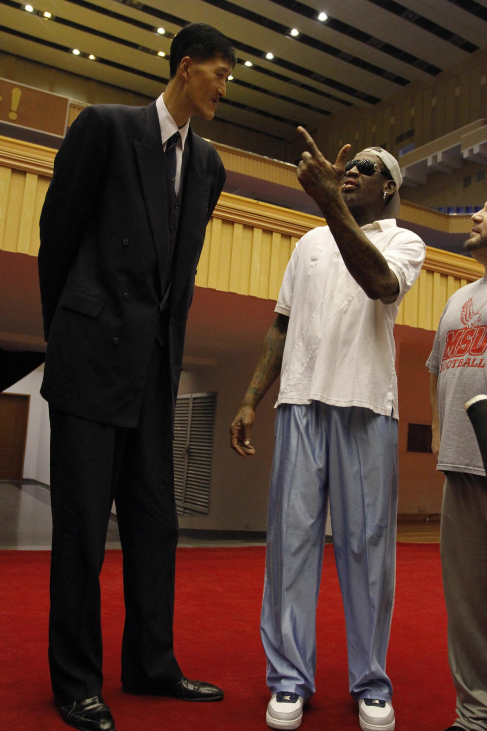 Dennis Rodman meets with former North Korean basketball player Ri Myung Hun, left, at a practice session with USA and North Korean players in Pyongyang, North Korea on Tuesday, Jan. 7, 2014. Rodman came to the North Korean capital with a squad of USA basketball stars for an exhibition game on Jan. 8, the birthday of North Korean leader Kim Jong Un. (AP Photo/Kim Kwang Hyon)