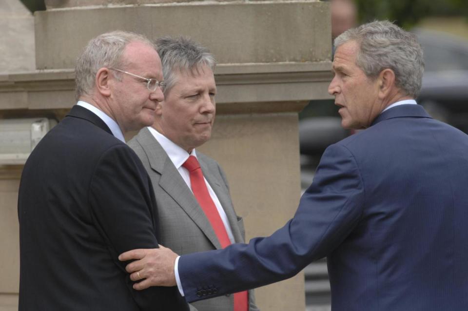 Political meetings: Martin McGuinness and First Minister Peter Robinson with former US President George Bush (PA)