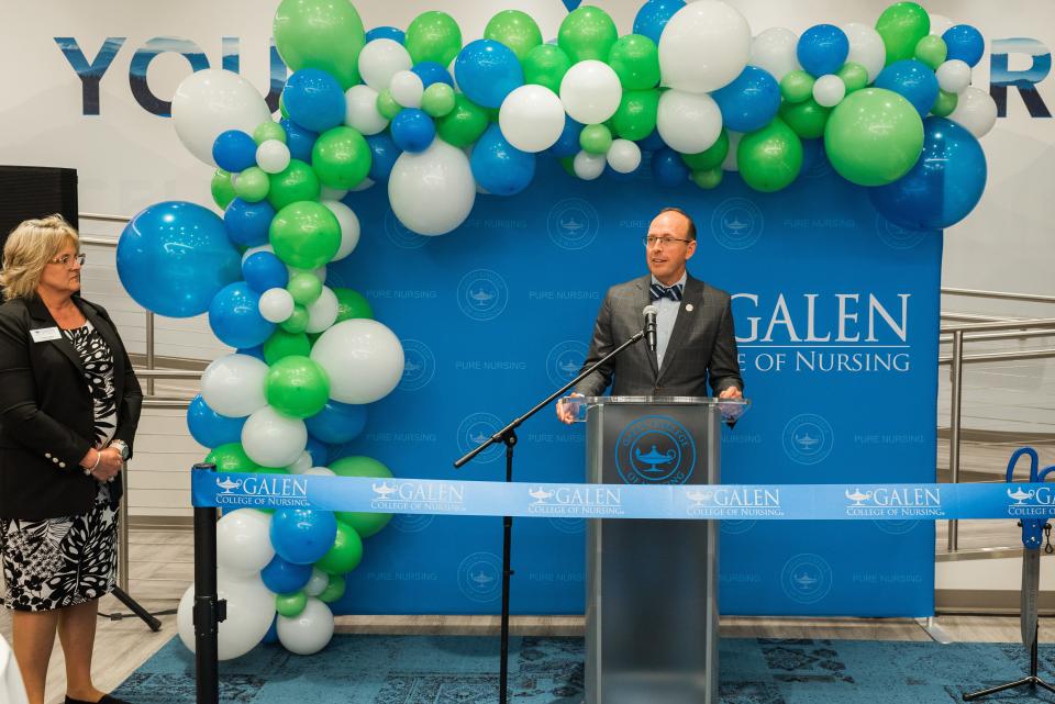 Galen College of Nursing Chief Executive Officer Mark Vogt speaks before the ribbon cutting at the institution's new Asheville campus, which opened Dec. 15.