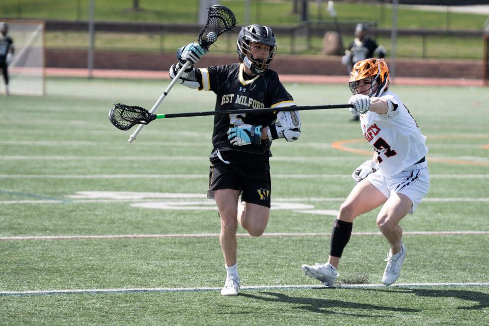 Apr 6, 2024; Tenafly, NJ, USA; West Milford boys lacrosse at Tenafly. WM #5 Max Gorny and T #17 David Levine.