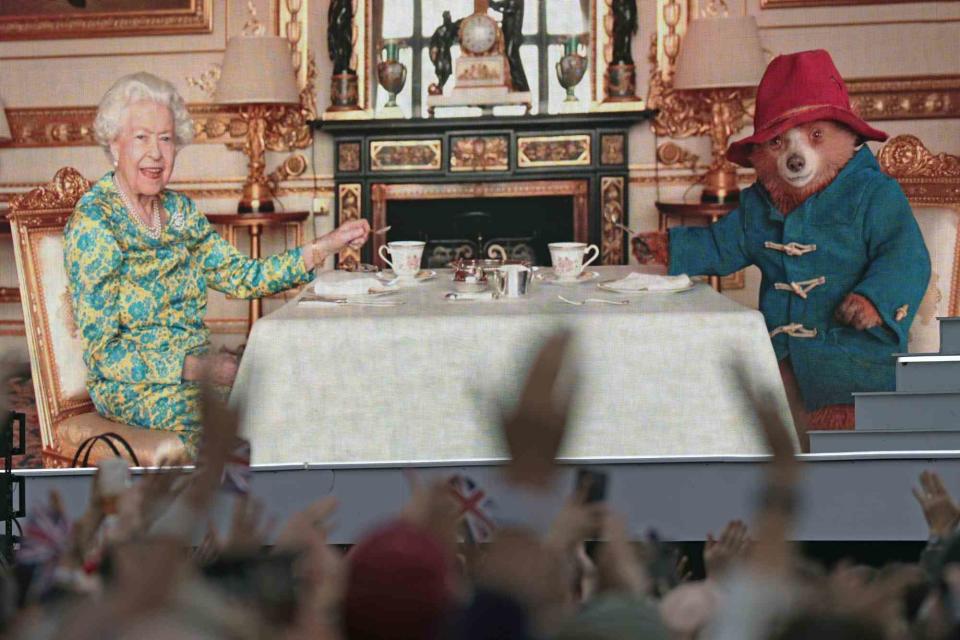 <p>Victoria Jones/PA Images via Getty </p> Queen Elizabeth shared tea with Paddington Bear in a pre-recorded skit that aired during Platinum Party at the Palace in June 2022. 