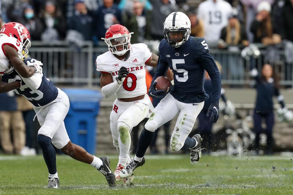 Nov 20, 2021; University Park, Pennsylvania, USA; Penn State Nittany Lions wide receiver Jahan Dotson (5) runs with the ball during the third quarter against the Rutgers Scarlet Knights at Beaver Stadium. Penn State defeated Rutgers 28-0. Mandatory Credit: Matthew OHaren-USA TODAY Sports