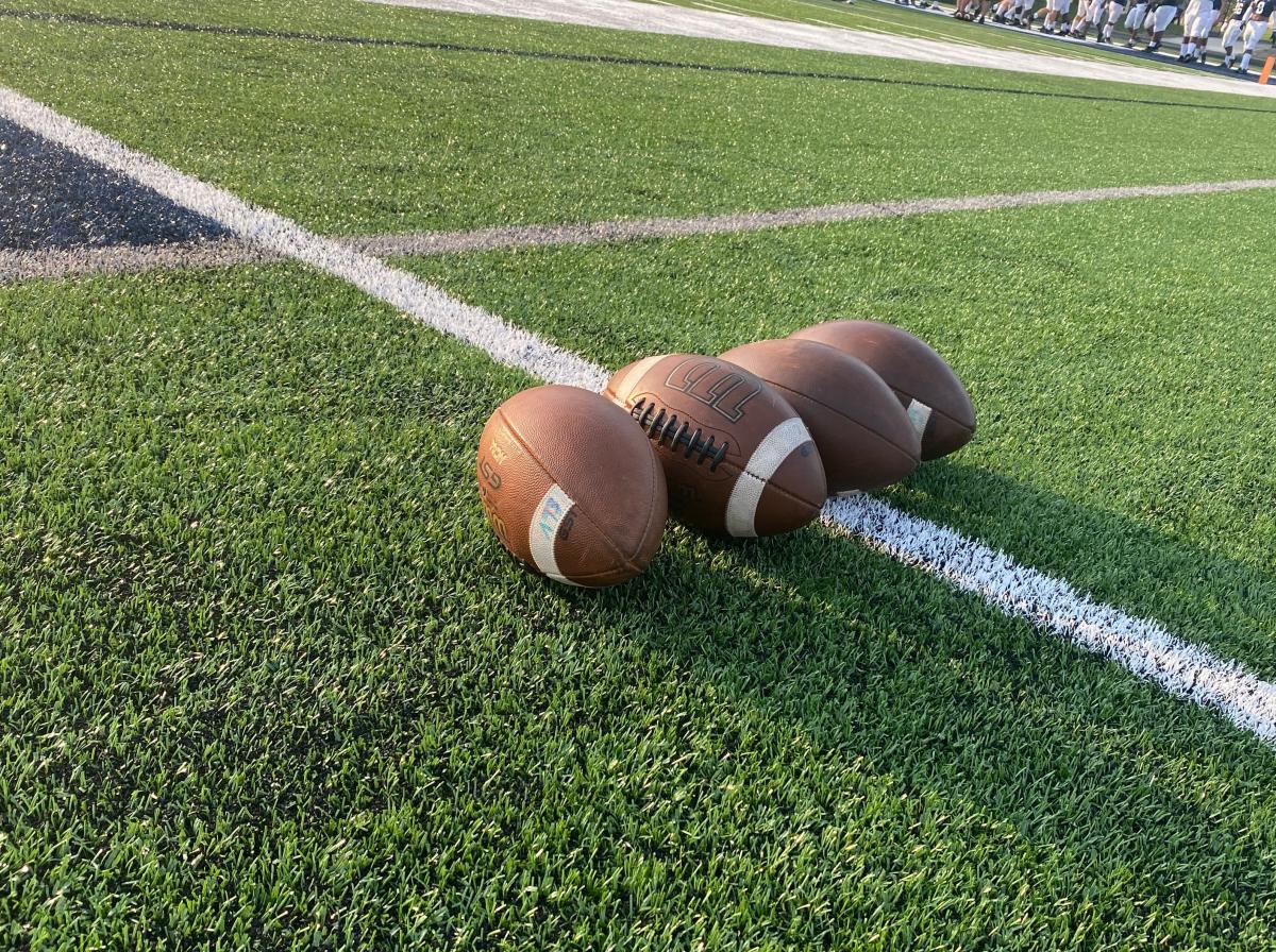 Danbury’s Elijah Hatfield runs for two scores, throws another in setback