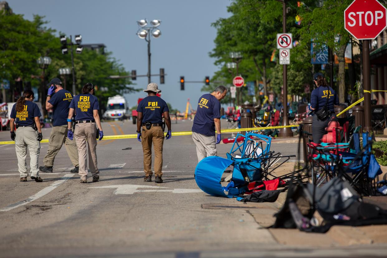 FBI agents work the scene Tuesday, a day after the shooting.