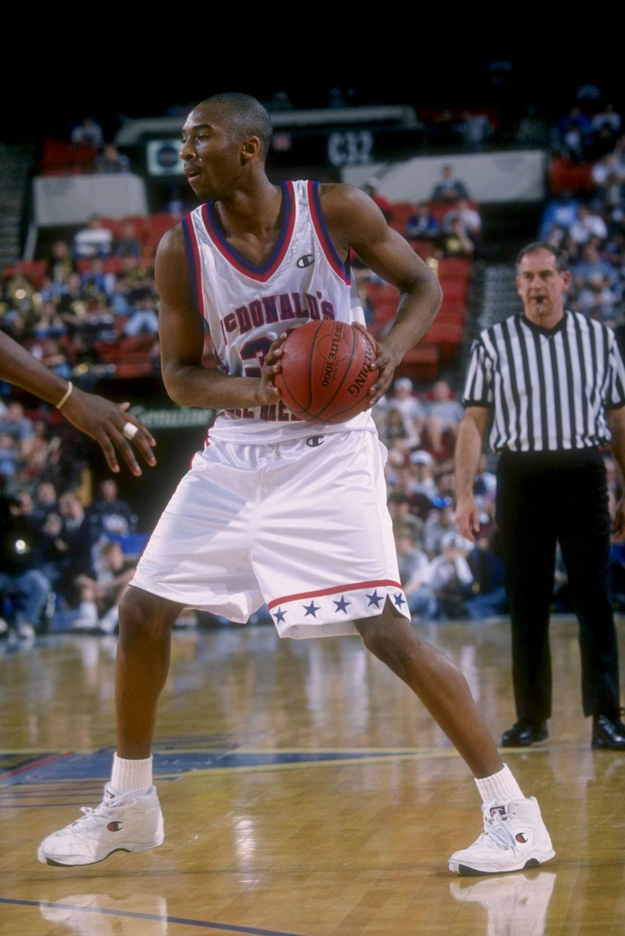 Kobe Bryant looks to pass the ball during the McDonald''s All-American at the Civic Arena in Pittsburgh, Pennsylvania on Mar 31, 1996.