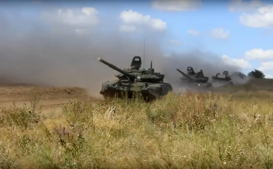 <em>Tanks roll during the military exercises in the Chita region (AP)</em>