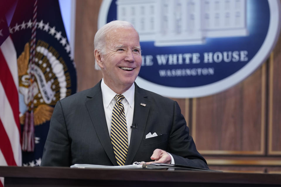 FILE - President Joe Biden smiles as he speaks about infrastructure in the South Court Auditorium on the White House complex in Washington, Oct. 19, 2022. Facing a midterm election that will define, and quite possibly constrict, the next two years of his term, President Joe Biden is treading a difficult line. At once he is the optimist, with a fulsome promise of better days ahead, only to then paint a what he sees as a darker portrait of a Congress potentially controlled by hard-right Republicans. (AP Photo/Susan Walsh, File)