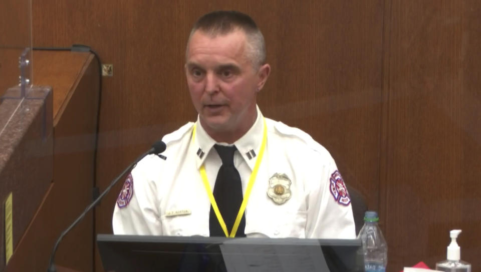 In this image from video, witness Capt. Jeremy Norton of the Minneapolis Fire Department answers questions as Hennepin County Judge Peter Cahill presides Thursday, April 1, 2021, in the trial of former Minneapolis police Officer Derek Chauvin at the Hennepin County Courthouse in Minneapolis, Minn. Chauvin is charged in the May 25, 2020 death of George Floyd. (Court TV via AP, Pool)