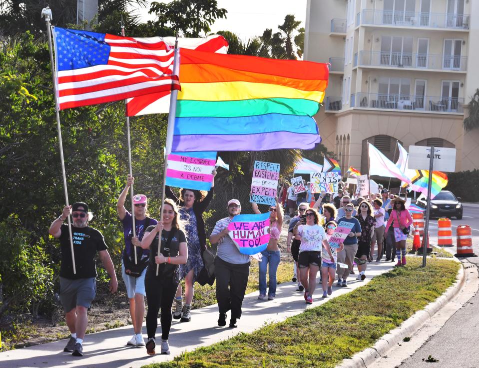 About 250 people gathered at Eau Gallie Square Friday evening to celebrate International Transgender Day of Visibility. The event was organized by Spektrum, a nonprofit LGBTQ healthcare provider with clinics in Orlando and Melbourne. At the end of the event they marched the causeway.