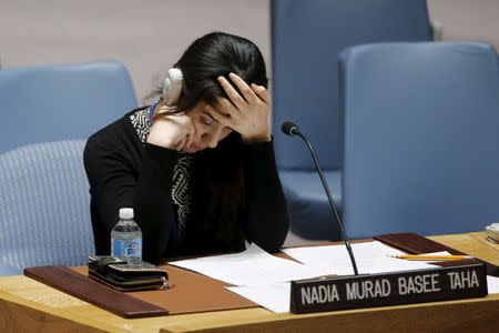 Nadia Murad Basee, a 21-year-old Iraqi woman of the Yazidi faith, reacts after speaking to members of the Security Council during a meeting at the United Nations Headquarters in New York, December 16, 2015. REUTERS/Eduardo Munoz