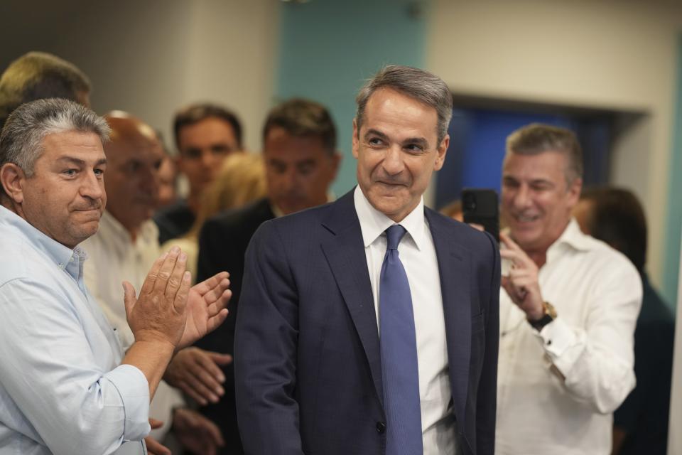 Kyriakos Mitsotakis leader of the center-right New Democracy arrives for statements at the headquarters of the party in Athens, Greece, Sunday, June 25, 2023. Greece's conservative New Democracy party has won a landslide victory in the country's second election in five weeks, with partial official results showing it gaining a comfortable parliamentary majority to form a government for a second four-year term. (AP Photo/Petros Giannakouris)