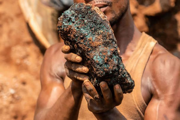 PHOTO: Dela wa Monga, an artisanal miner, holds a cobalt stone at the Shabara artisanal mine near Kolwezi on Oct. 12, 2022. (Junior Kannah/AFP via Getty Images,FILE)