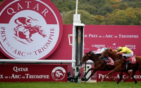 Italian Lanfranco Dettori riding British horse Enable, left, ahead of JW Doyle riding Irish horse Sea of Class - Credit: AP Photo/Francois Mori