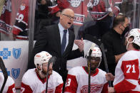 Detroit Red Wings head coach Jeff Blashill, top center, gives instructions during the third period of an NHL hockey game against the Pittsburgh Penguins in Pittsburgh, Friday, Jan. 28, 2022. (AP Photo/Gene J. Puskar)