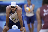 Alison Cerutti, of Brazil, waits for the serve during a men's beach volleyball quarterfinal match against Latvia at the 2020 Summer Olympics, Wednesday, Aug. 4, 2021, in Tokyo, Japan. (AP Photo/Felipe Dana)