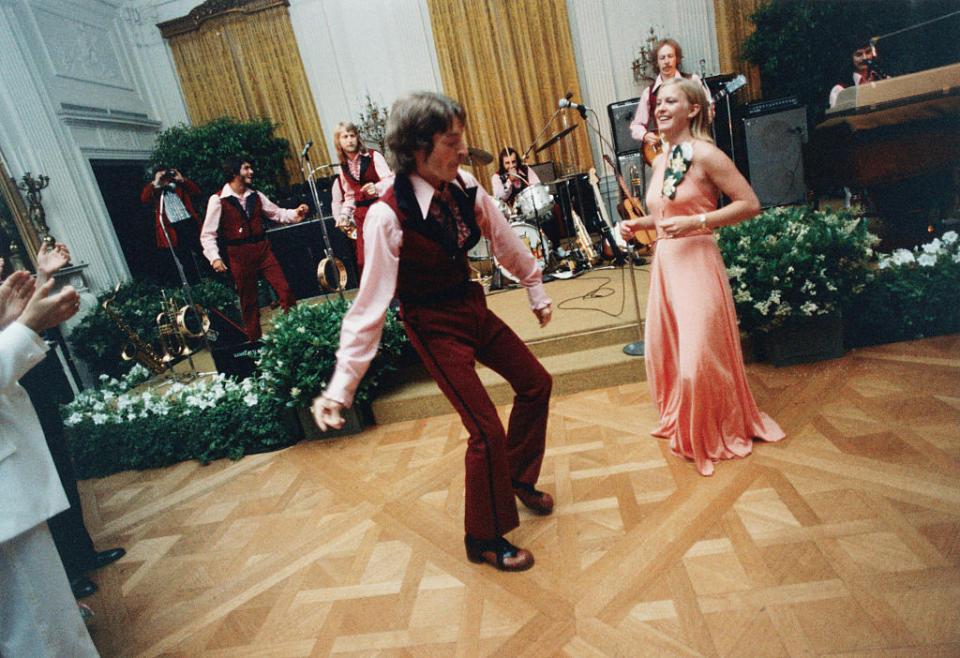 1975: Susan Ford and her date, William Pifer, dance during the 1975 Holton Arms School Senior Prom, held in the East Room of the White House. (Photo: Getty Images)