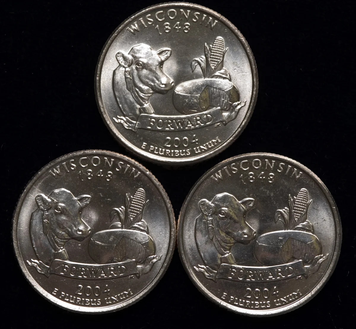 Some 2004 Wisconsin state quarters have an error, upping the coin's value, and a..