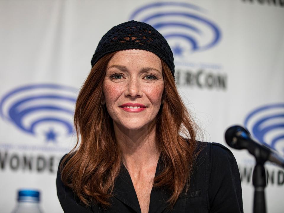 Annie Wersching in a black top and cap