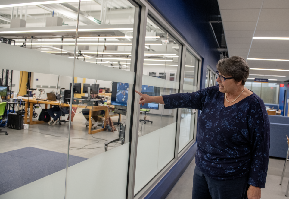 Christina Bloebaum, dean and professor of Kent State's College of Aeronautics and Engineering, gives a tour of the completed expansion of the building, including a classroom in the robotics heavy lower level called the Bot Bunker.