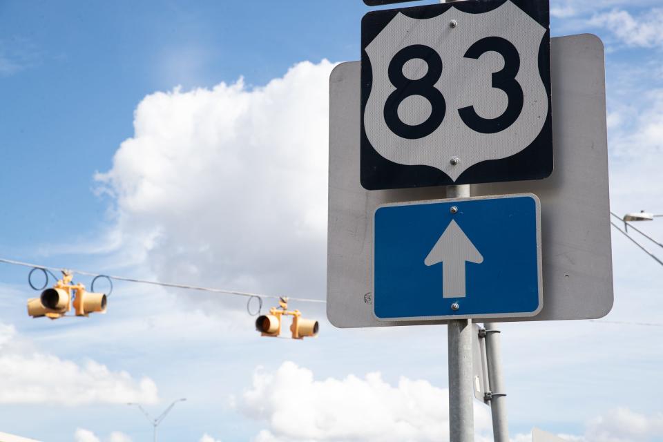 A Highway 83 road sign posted along a frontage road on Oct. 6, 2022, in Harlingen, Texas.