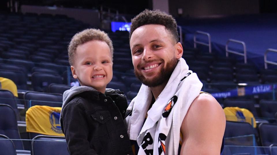 Stephen Curry #30 of the Golden State Warriors poses with his son Canon after the game against the Utah Jazz on March 14, 2021 at Chase Center in San Francisco, California