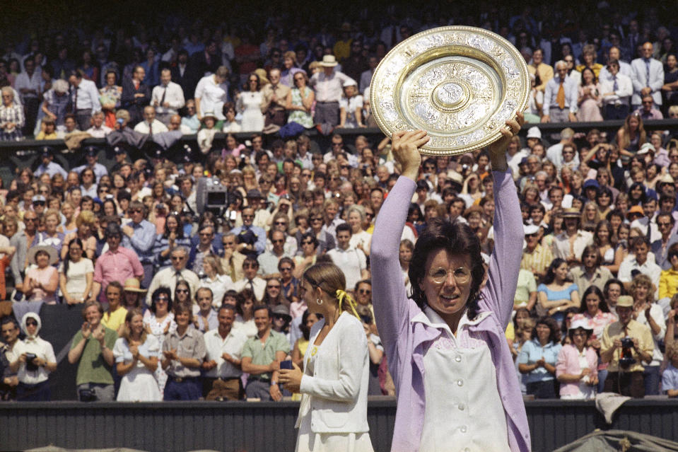 FILE - In this July 7, 1973, file photo, Billie Jean King holds up the championship trophy after defeating Chris Evert in the Wimbledon women's singles final in London. This was King's fifth time winning Wimbledon. (AP Photo/File)