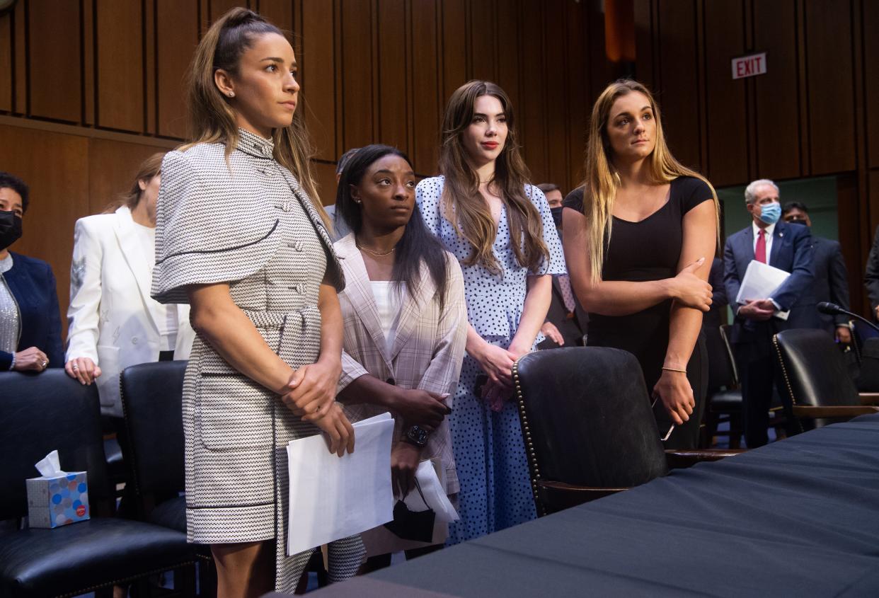 Olympic gymnasts Aly Raisman, left, Simone Biles, McKayla Maroney and NCAA and world champion gymnast Maggie Nichols leave after testifying during a Senate Judiciary hearing about the Inspector General's report on the FBI handling of the Larry Nassar investigation of sexual abuse of Olympic gymnasts on Sept. 15, 2021 in Washington, D.C.