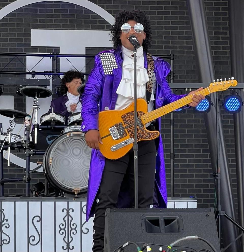 Shane Golden, lead singer for The Prince Project, performs Saturday at the Jackson Amphitheater. The Prince tribute act is among the tribute bands that have drawn people to weekend concerts since the venue opened in June 2021.