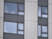 A boy looks out of a window in the Dorney Tower residential block, as residents were evacuated as a precautionary measure following concerns over the type of cladding used on the outside of the buildings on the Chalcots Estate in north London, Britain, June 24, 2017. REUTERS/Hannah McKay