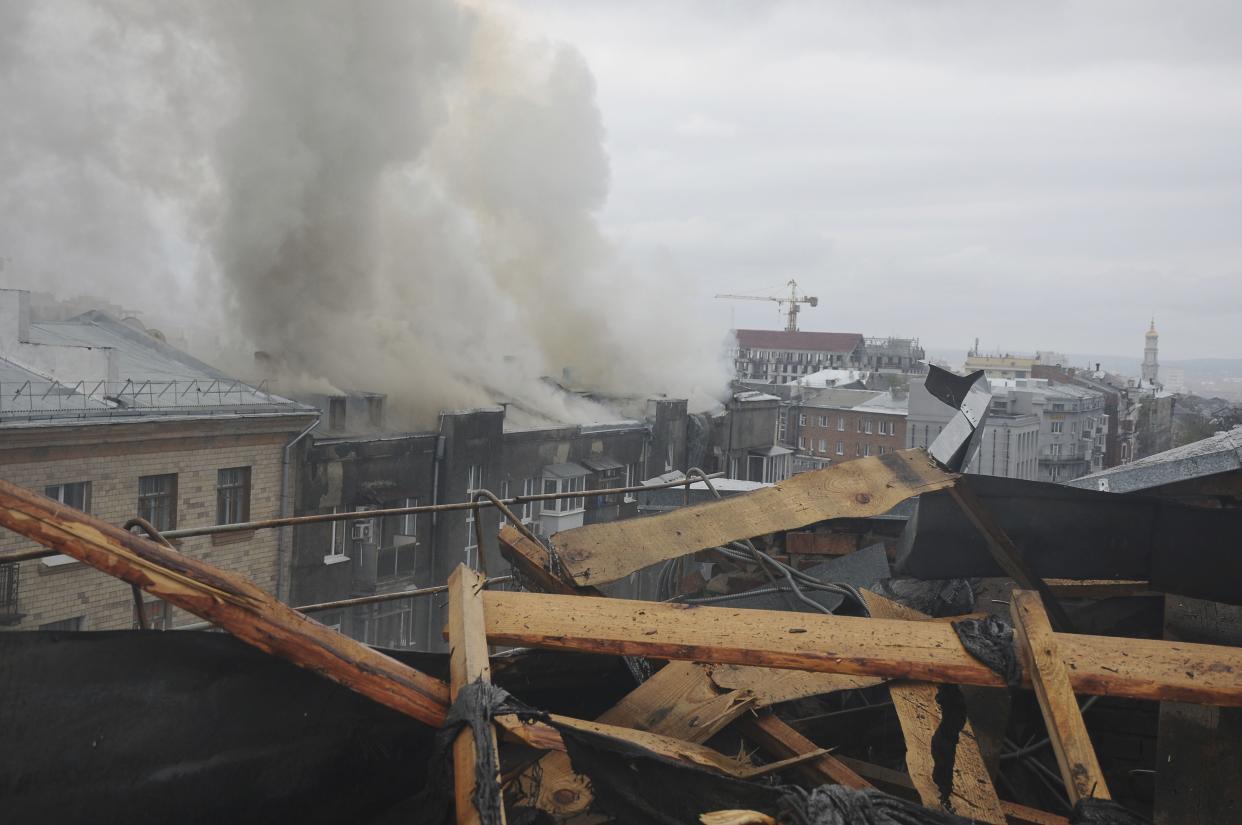 Smoke rises over an apartment building after a Russian attack in Kharkiv, Ukraine, Sunday, April 17, 2022. 