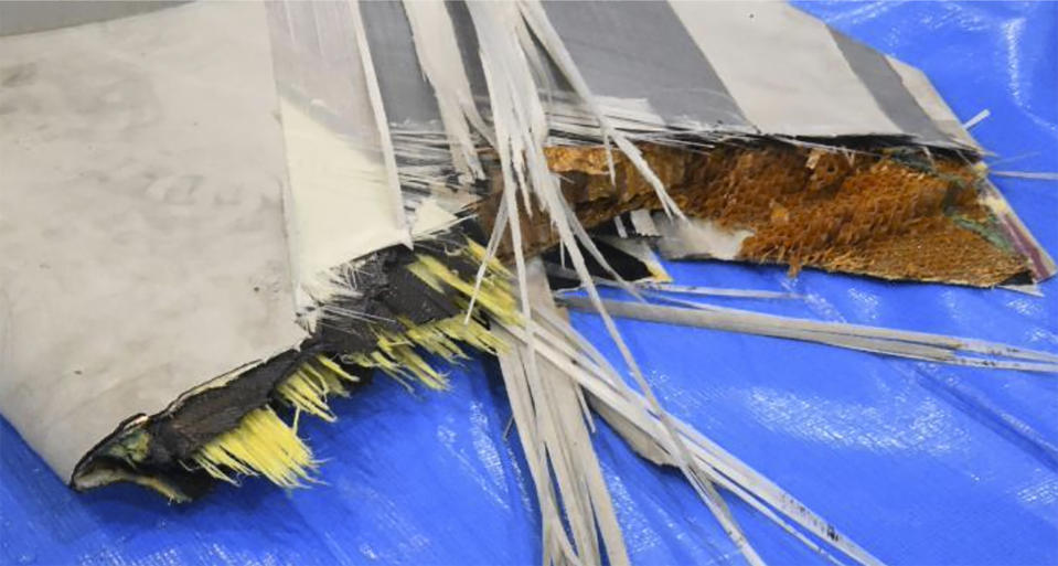 This image released by Japan Maritime Self-Defense Force shows a retrieved component which is believed to be a part of a crashed helicopter, Sunday, April 21, 2024. Initial analysis of flight data recorders recovered from the waters in the Pacific near the crash site of the two Japanese navy helicopters showed no sign that mechanical problems in the aircraft caused the accident, Japan’s defense minister said Monday, as he indicated human error. (Japan Maritime Self-Defense Force via AP)