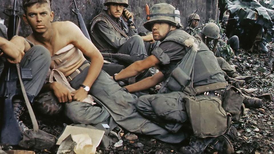 Corpsman D.R. Howe treats the wounds of Pfc. D.A. Crum, with H Company, 2nd Battalion, 5th Marines, during Operation Hue City on Feb. 6, 1968. (National Archives/Office of the Secretary of Defense)