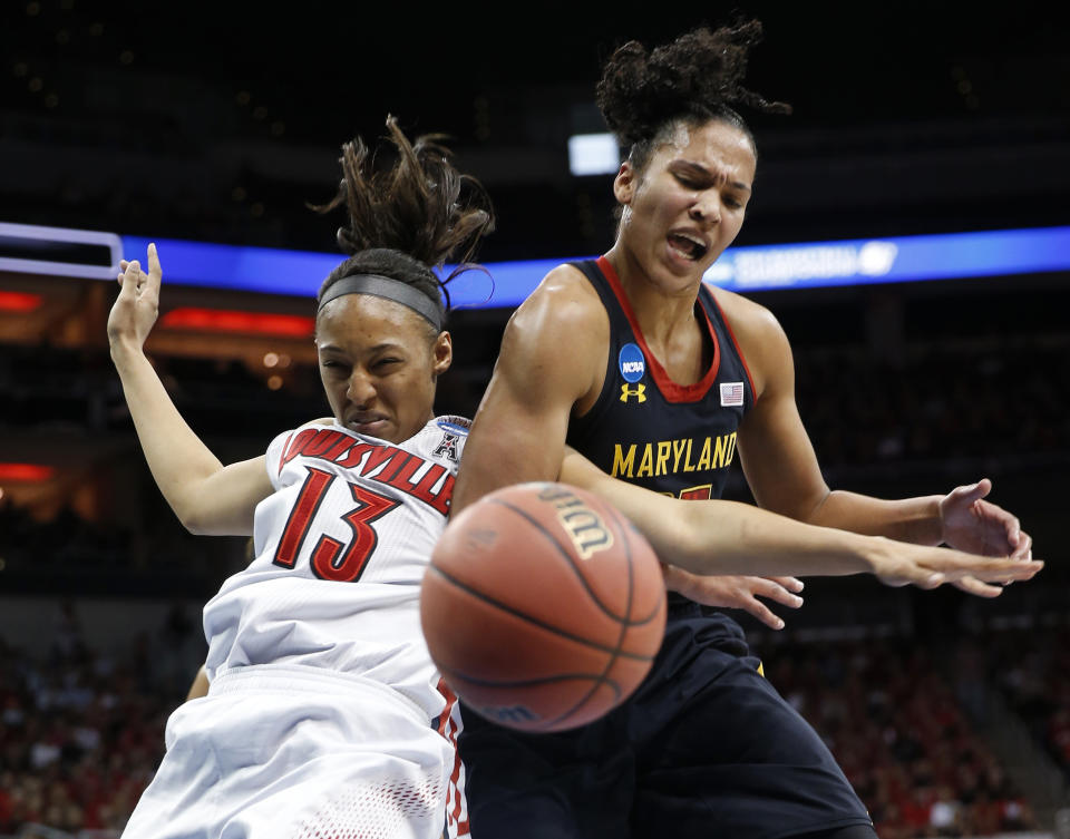 Louisville forward Cortnee Walton (13) and Maryland forward Alyssa Thomas scramble for a rebound during the first half of a regional final in the NCAA women's college basketball tournament, Tuesday, April 1, 2014, in Louisville, Ky. (AP Photo/John Bazemore)