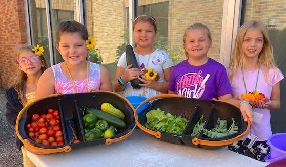 Watertown Boys & Girls Club members Ellesyn Fishbach, left, Deklyn Gaultapp, Korri Herr, Aria Bartells and Aleight Severson with the day's harvest. Foods grown in the garden boxes are brought to the club's kitchen where they are used to make meals for lunch.