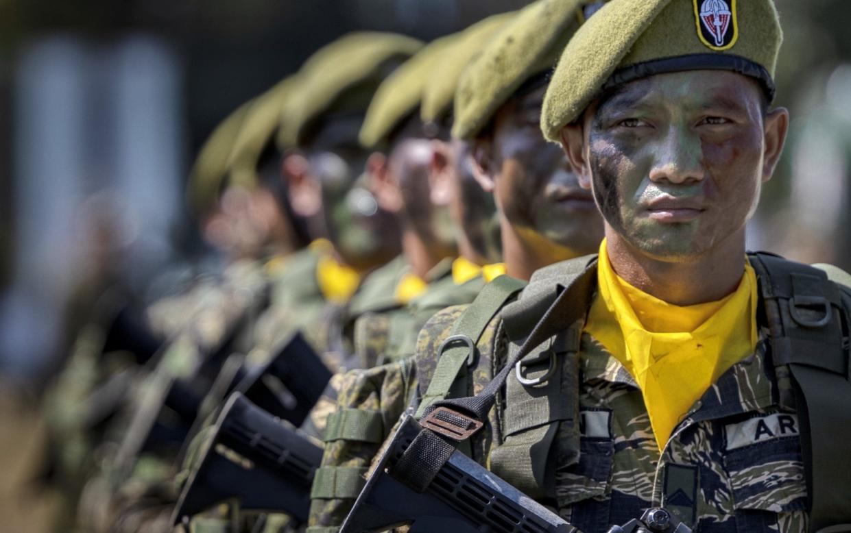 Philippine troops stand in formation during a ceremony attended by President Ferdinand Marcos Jr. on Wednesday. - Ezra Acayan/Getty Images AsiaPac