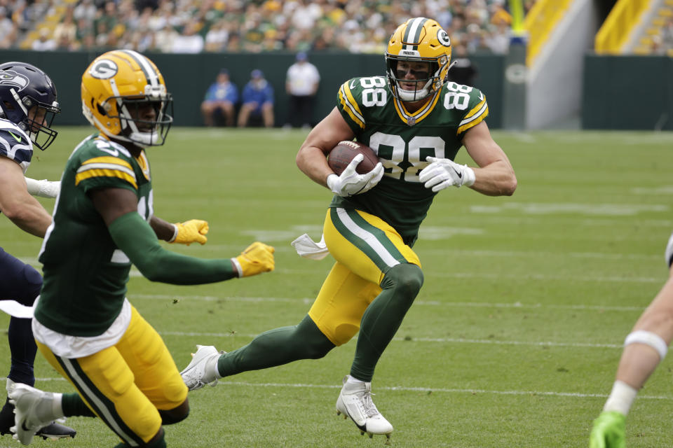 Green Bay Packers tight end Luke Musgrave (88) runs up field after catching a pass in the first half of a preseason NFL football game against the Seattle Seahawks, Saturday, Aug. 26, 2023, in Green Bay, Wis. (AP Photo/Mike Roemer)