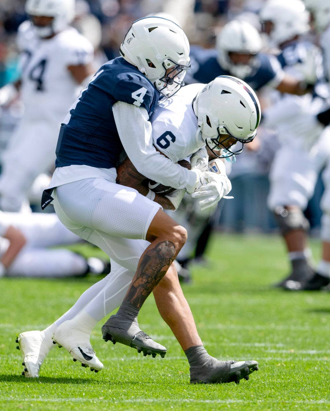 Penn State cornerback A.J. Harris stops wide receiver Harrison Wallace III during the Blue-White game on Saturday, April 13, 2024.