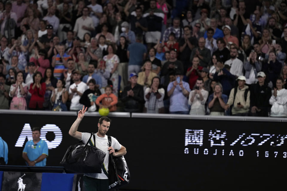 Andy Murray of Britain gestures as he leaves Margaret Court Arena following his third round loss to Roberto Bautista Agut of Spain at the Australian Open tennis championship in Melbourne, Australia, Saturday, Jan. 21, 2023. (AP Photo/Ng Han Guan)