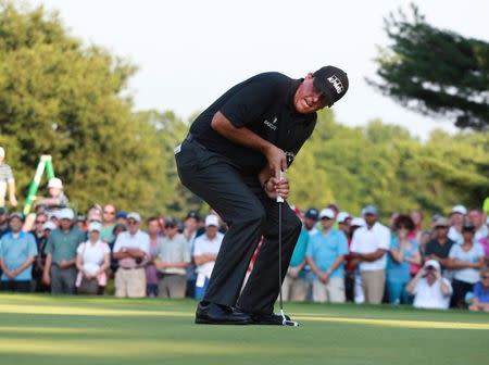 Jul 29, 2016; Springfield, NJ, USA; PGA golfer Phil Mickelson reacts to missing a birdie putt on the 15th hole during the second round of the 2016 PGA Championship golf tournament at Baltusrol GC - Lower Course. Mandatory Credit: Brian Spurlock-USA TODAY Sports